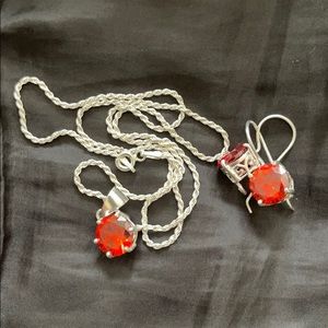 Silver necklace with red stone